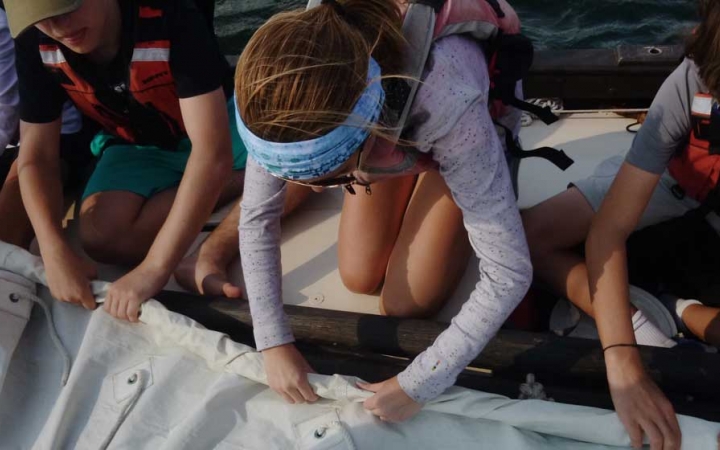 middle schoolers learn sailing skills at outdoor school
